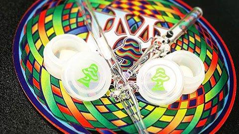 Dab Straws and concentrate containers on a Dab Pad